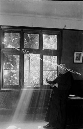 SUNLIGHT STUDY REV.M.CAMPBELL O.S.B. IN PRESBYTERY WITH FLASH